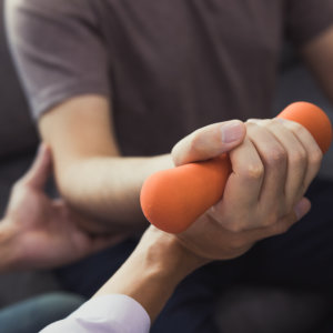 physiotherapists help raise arms for patients