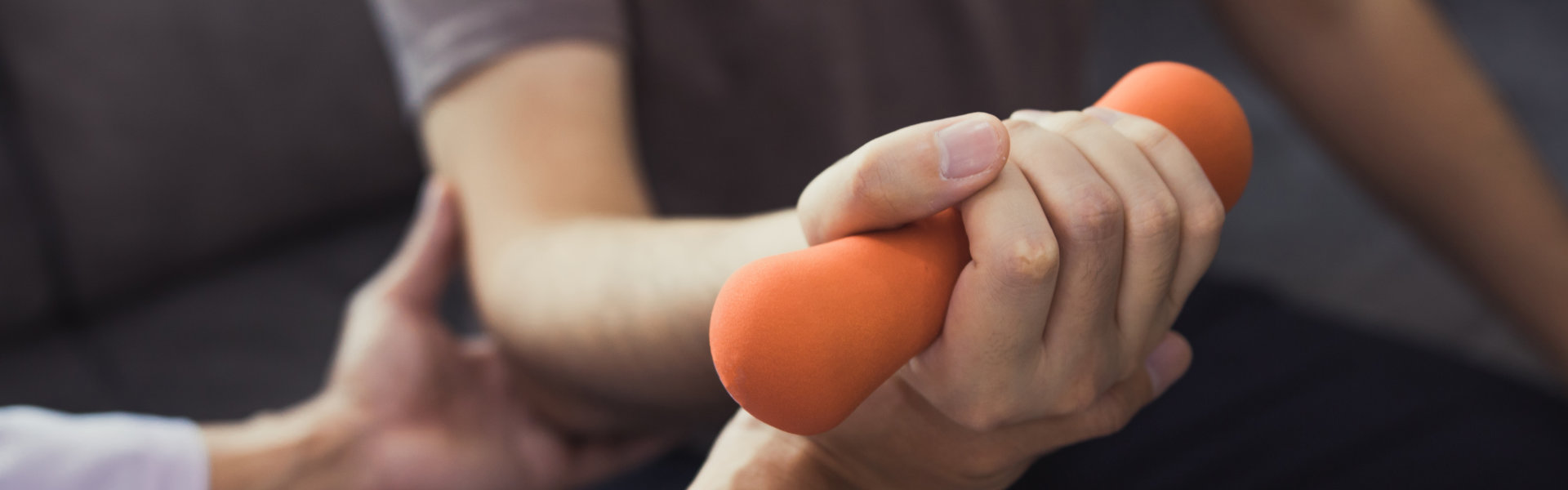 physiotherapists help raise arms for patients