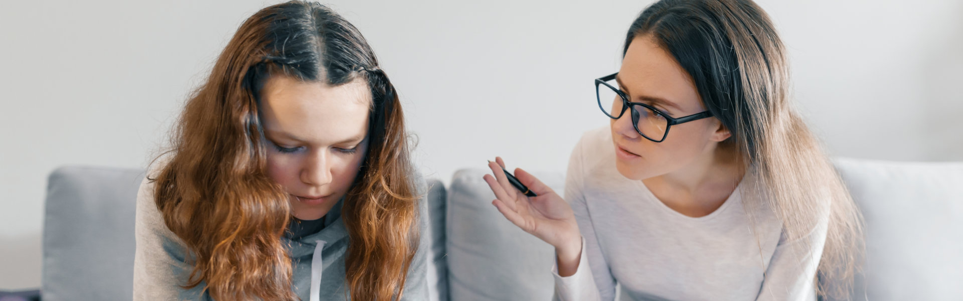 adult lady talking to the young girl